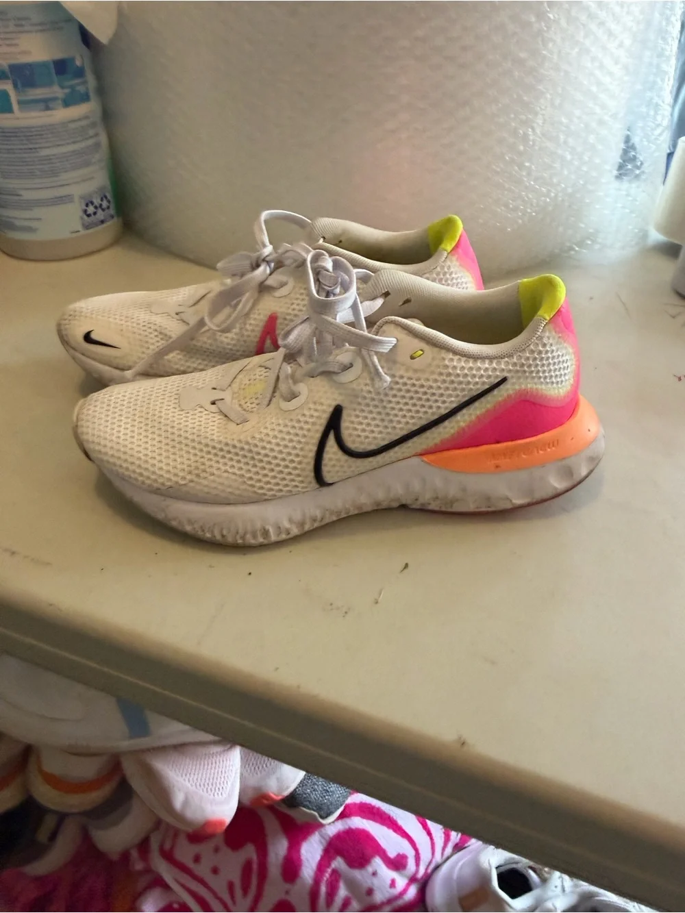 Nike women’s size 7 Renew Running Shoe pink orange yellow